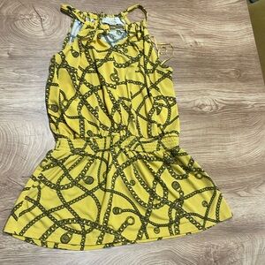MIK yellow peplum hem top with gold accents and halter neckline